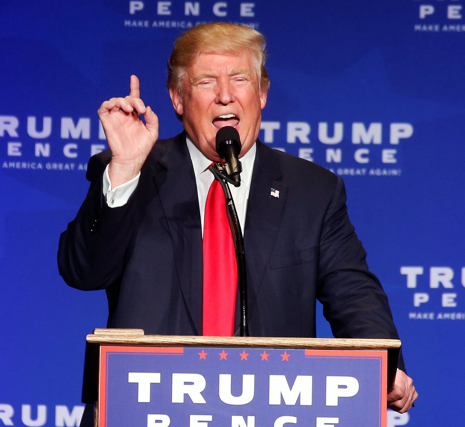 Republican presidential nominee Donald Trump speaks after returning to the stage following a security incident, where he was hustled off the stage by security agents due to a perceived threat in the crowd, during a campaign rally in Reno, Nevada