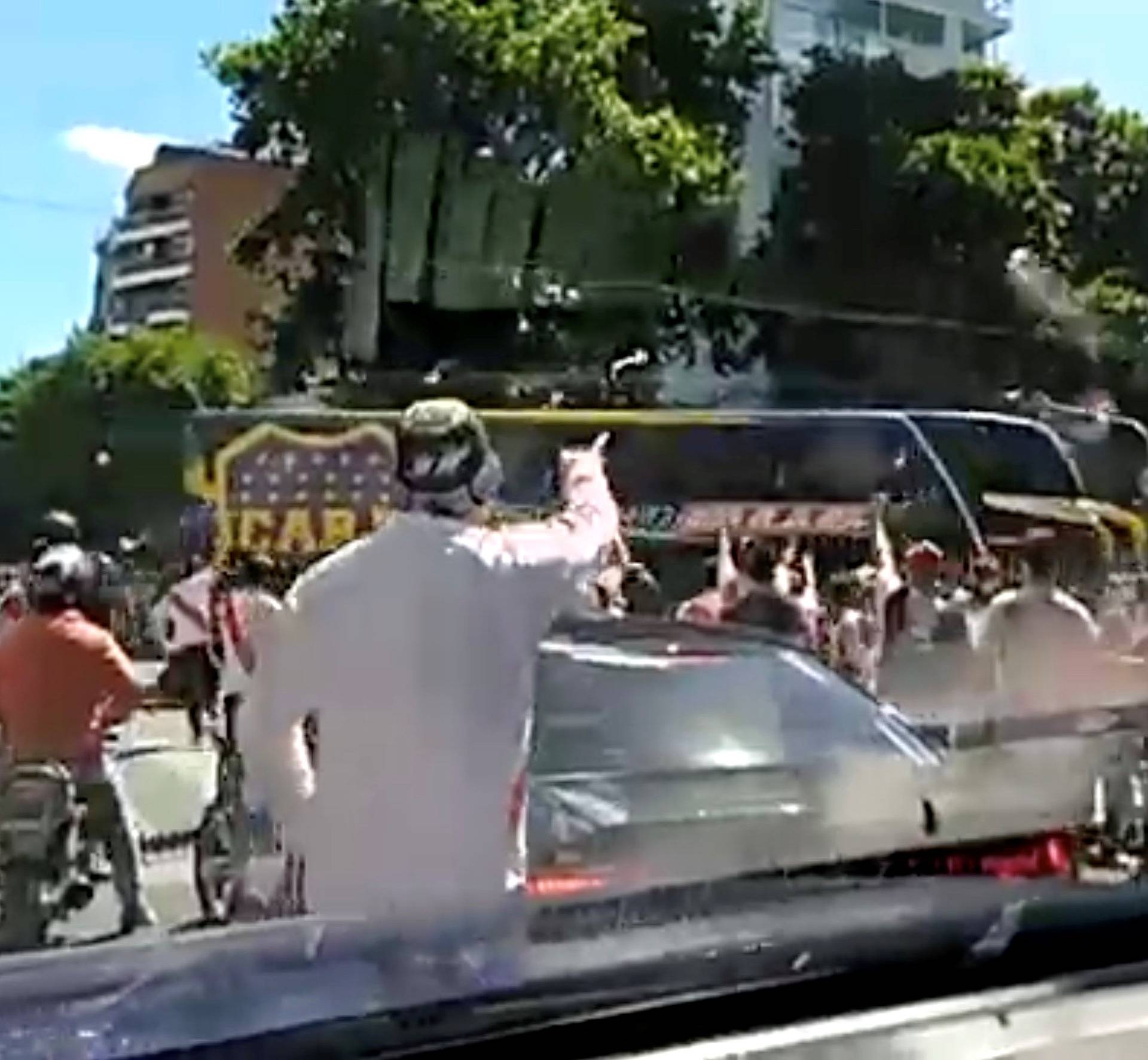 A Boca Juniors bus is attacked by opposition fans in Buenos Aires