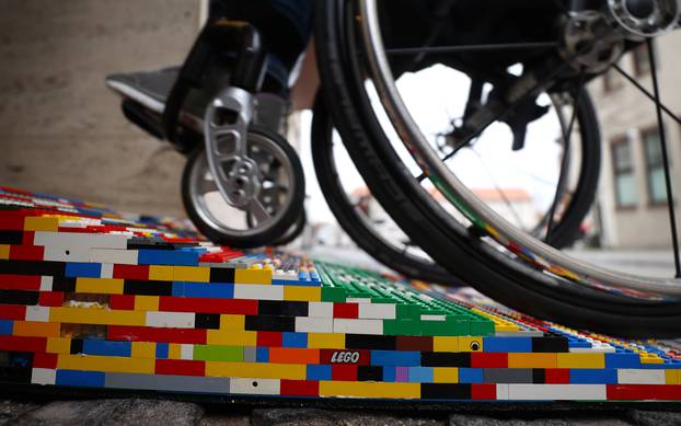 Rita Ebel, nicknamed "Lego grandma", tests one of her wheelchair ramps built from donated Lego bricks in Hanau