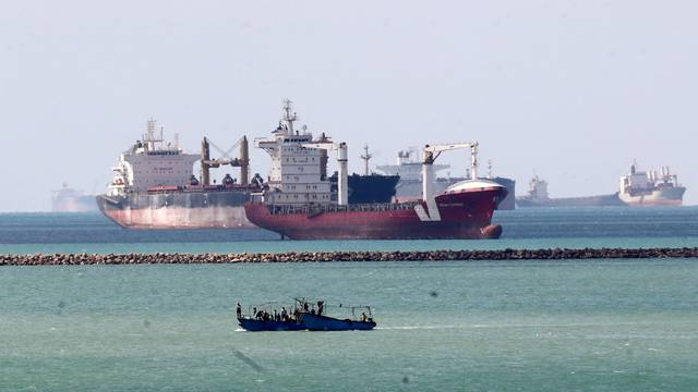 FILE PHOTO: Ships and boats are seen at the entrance of Suez Canal, which was blocked by stranded container ship Ever Given that ran aground