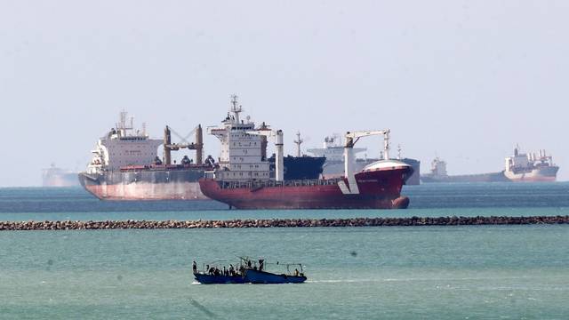 FILE PHOTO: Ships and boats are seen at the entrance of Suez Canal, which was blocked by stranded container ship Ever Given that ran aground