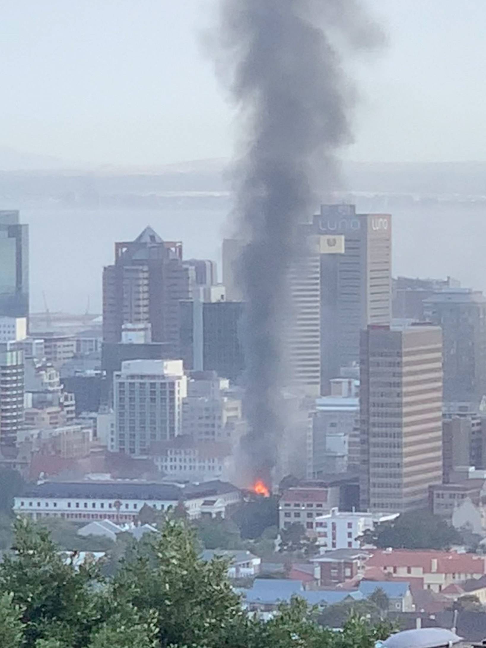 Smoke rises from a burning building in Cape Town