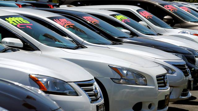 FILE PHOTO: Automobiles are shown for sale at a car dealership in Carlsbad, California