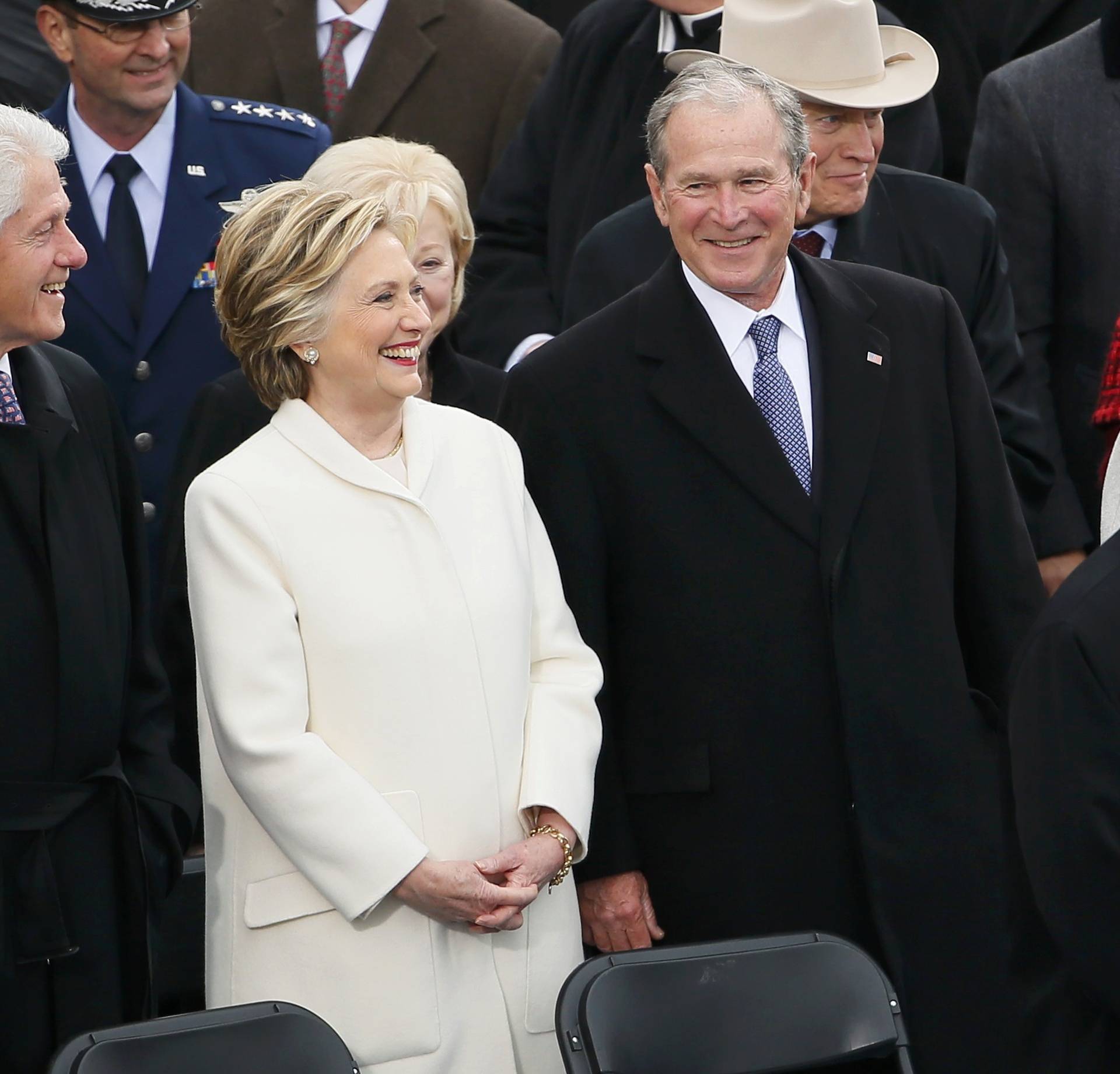 Hillary Clinton stands between former Presidents Bill Clinton and George W. Bush during inauguration ceremonies in Washington
