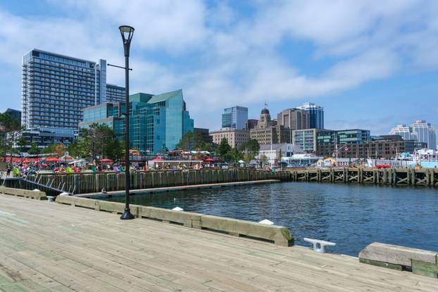 People enjoy sunny day at Halifax Harbourfront, Canada