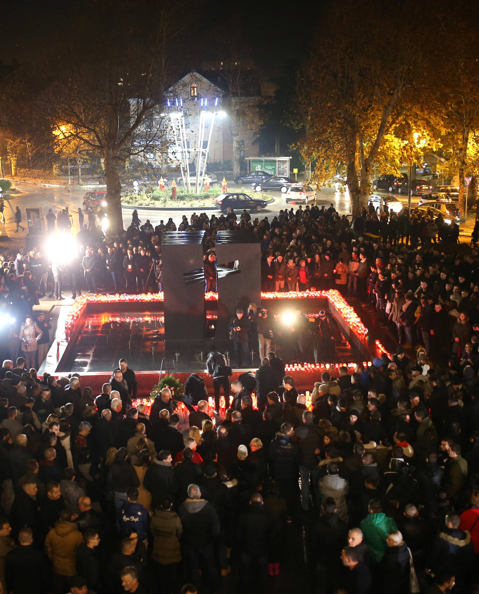 Bosnian Croats pray and light candles for the convicted general Slobodan Praljak, who killed himself seconds after the verdict in the U.N. war crimes tribunal in The Hague, in Mostar