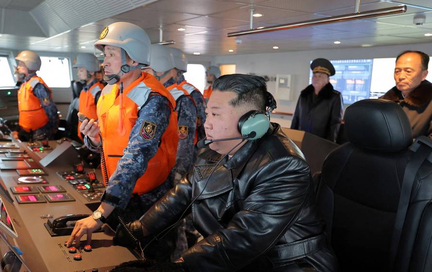 North Korean leader Kim Jong Un inspects the operation of the Choe Hyon naval destroyer during a visit to the Nampho Shipyard