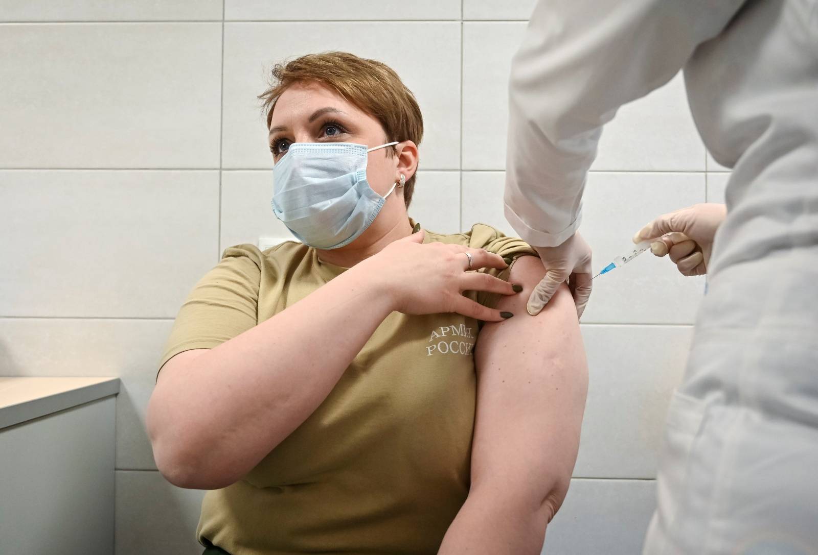 FILE PHOTO: A Russian Army service member receives an injection with Sputnik V (Gam-COVID-Vac) vaccine against the coronavirus disease (COVID-19) at a clinic in the city of Rostov-On-Don