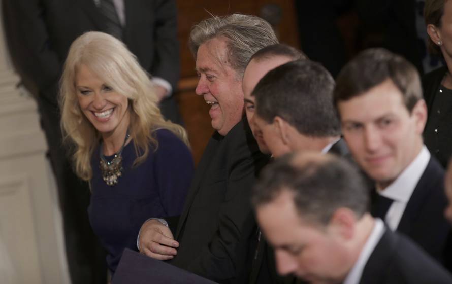 White House aides gather prior to Trudeau-Trump joint news conference at the White House in Washington