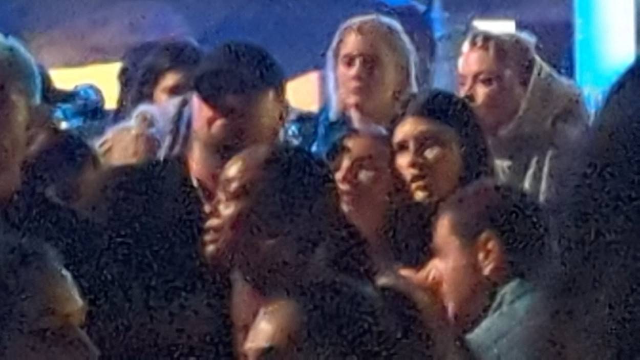Leonardo DiCaprio parties with a group of girls at his VIP table at Coachella Festival