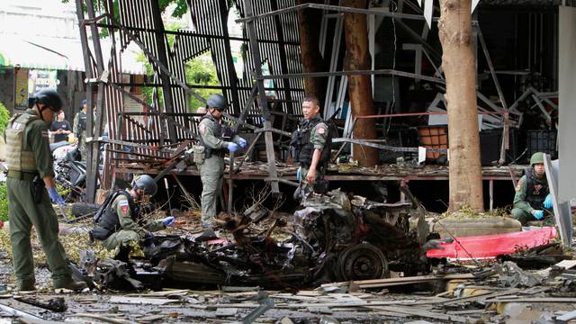 Thai soldiers inspect the scene of a car bomb blast outside a hotel in the southern province of Pattani