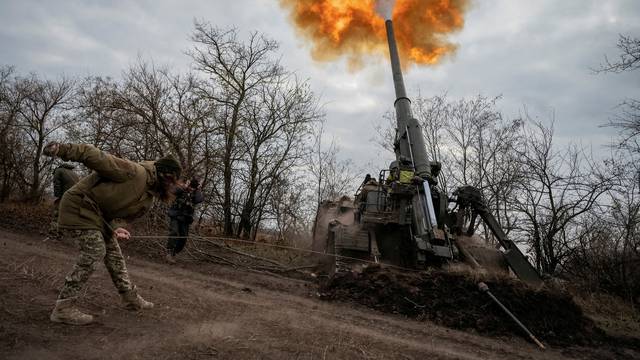 FILE PHOTO: Ukrainian servicemen fire a 2S7 Pion self-propelled gun at a position on a frontline in Kherson region
