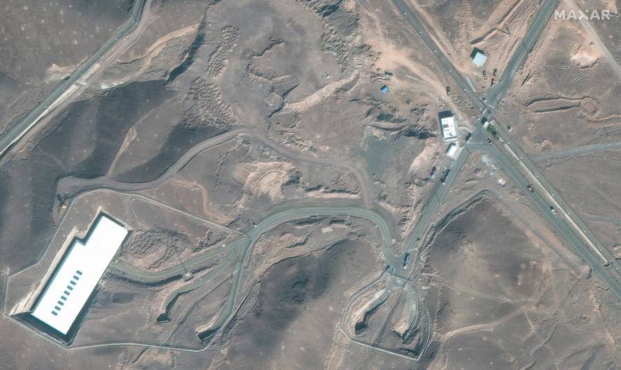 A satellite image shows trucks and bulldozers near the entrance to the Fordow nuclear facility, near Qom