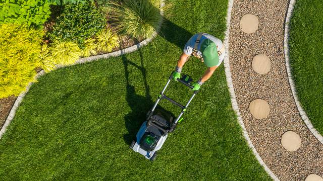 Caucasian,Gardener,Mowing,Backyard,Garden,Grass,Using,Cordless,Electric,Grass