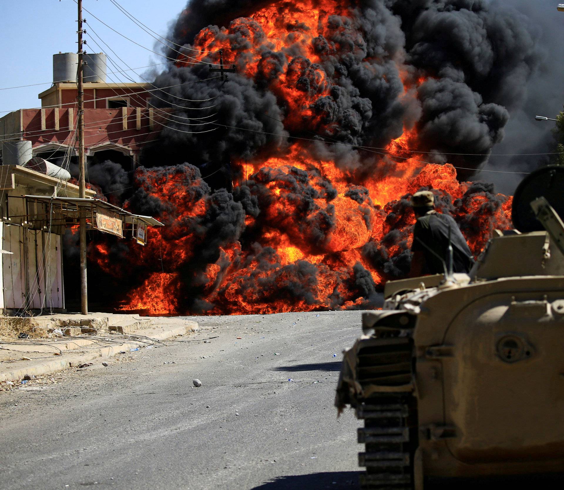 Smoke rises during clashes between joint troop of Iraqi army and Shi'ite Popular Mobilization Forces (PMF) against the Islamic State militants in Tal Afar