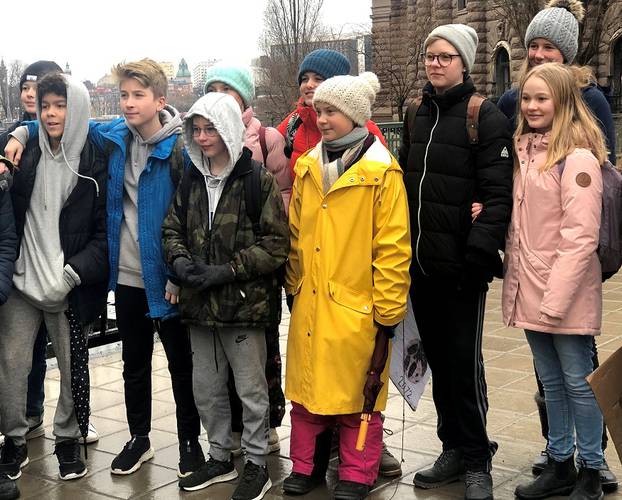 Swedish 16-year-old environmental activist Greta Thunberg attends a protest next to Sweden