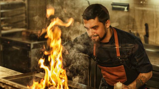 Bearded,Handsome,Man,In,Jeans,Apron,And,With,Tattoo,On