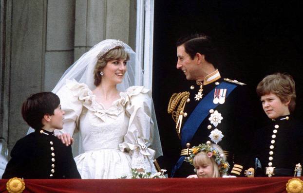 FILE PHOTO: Prince Charles and Princess Diana stand on the balcony of Buckingham Palace following their wedding at St. Paul's Cathedral