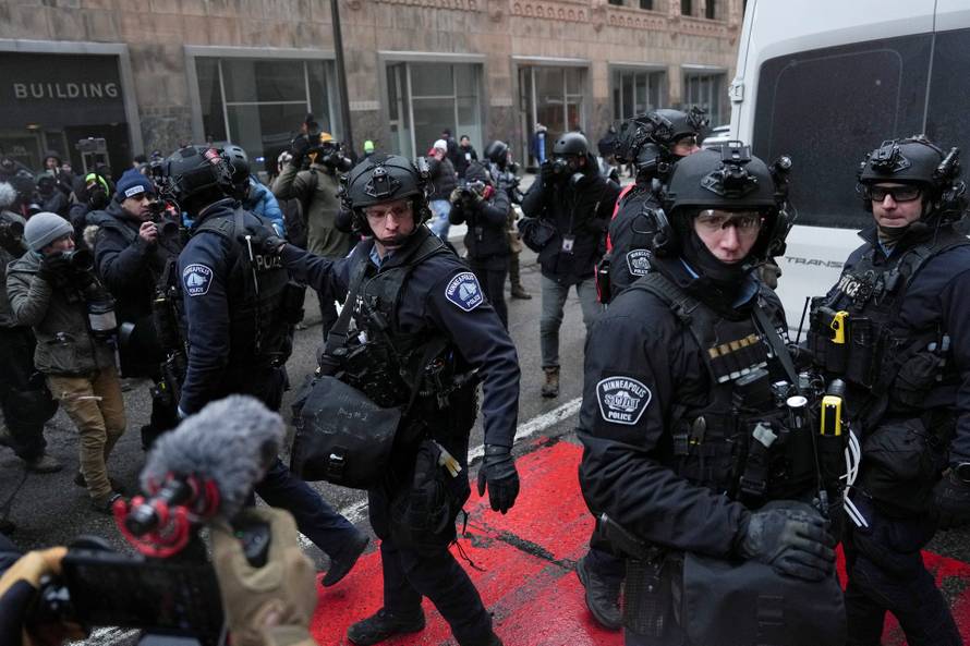 People attend the "March Against Minnesota Fraud" in Minneapolis