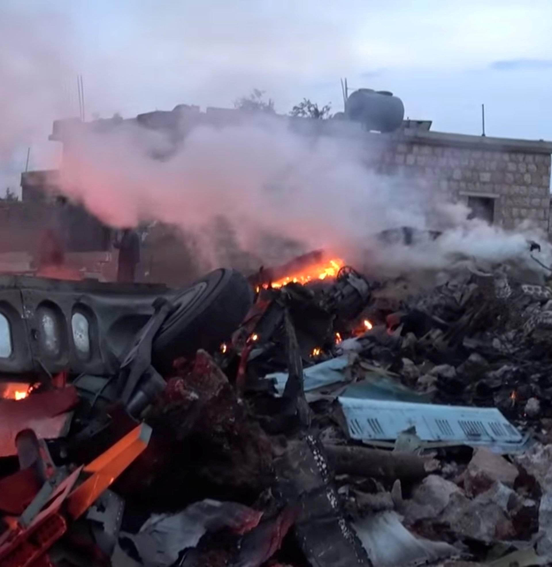 The scene shows, what according to Syrian rebels were fires caused by Russian military plane shot down by rebel forces near Idlib