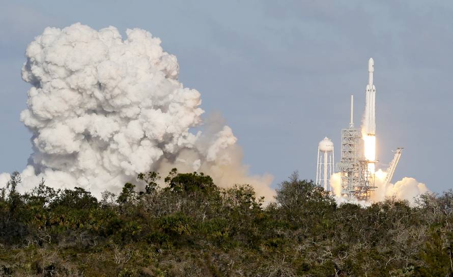 A SpaceX Falcon Heavy rocket lifts off from the Kennedy Space Center in Cape Canaveral