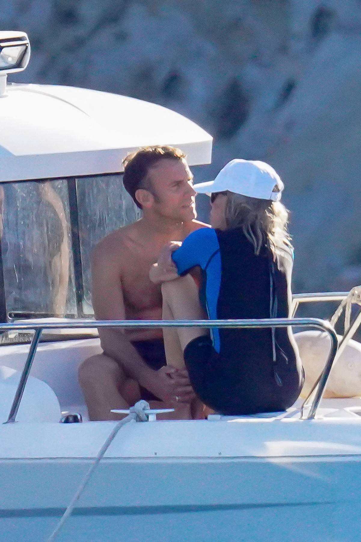 EXCLUSIVE: Emmanuel Macron and his wife Brigitte enjoy a boat day in Porquerolles island during their presidential holidays in South of France