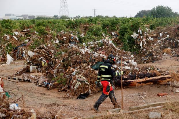 Members of the military search for bodies of people missing after heavy rains, in Quart de Poblet