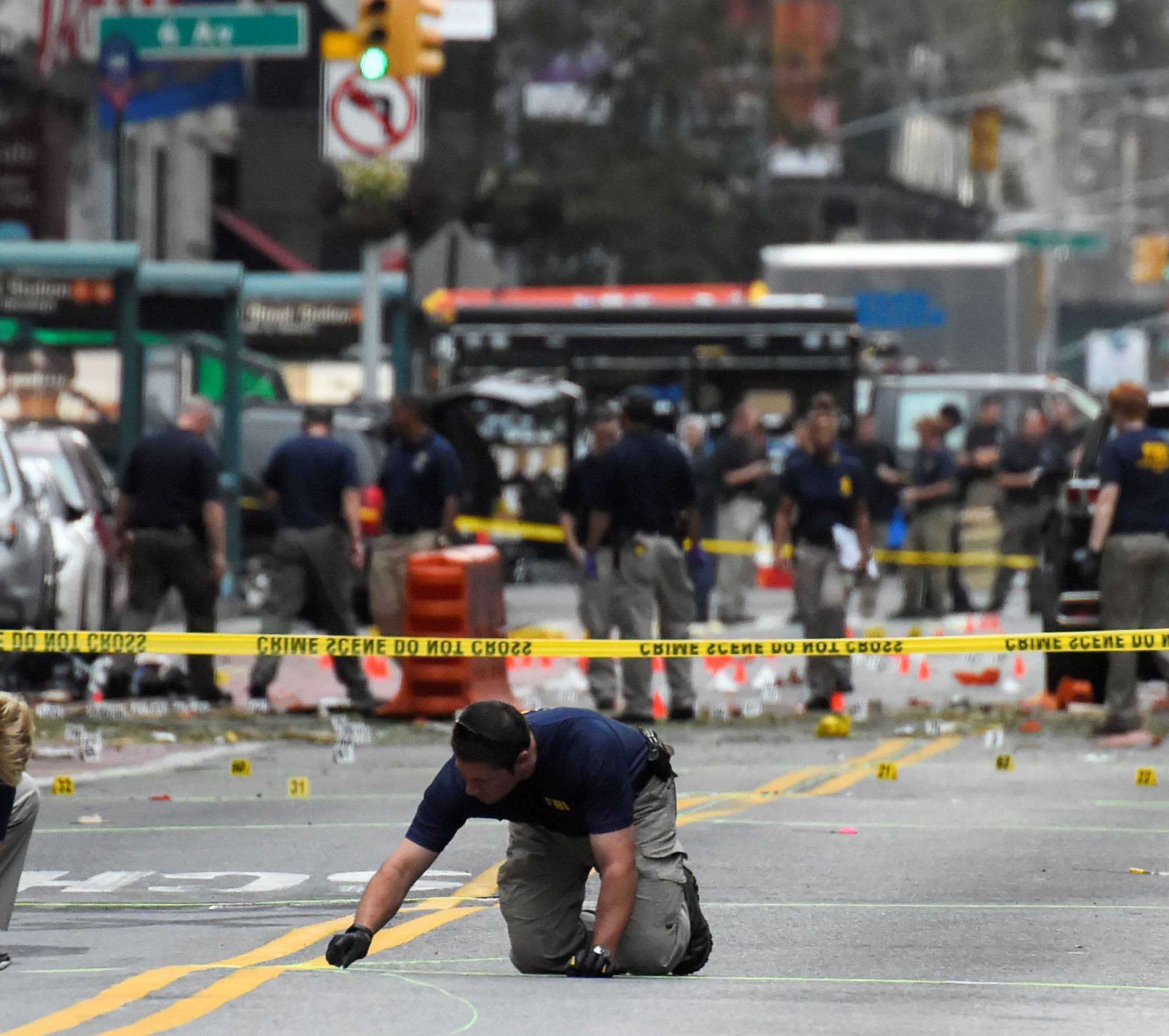 FBI officials mark ground near site of explosion in New York