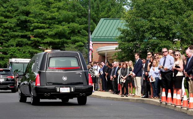 The hears carrying Otto Warmbier departs for the cemetery after a funeral service for Warmbier, who died after his release from North Korea, at Wyoming High School in Wyoming