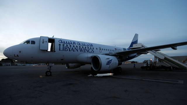 Plane, that was damaged during clashes, is seen at Mitiga airport in Tripoli