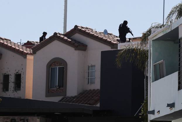 Security forces operate near a crime scene where a U.S. citizen shot and killed a state Mexican police officer, in Tijuana