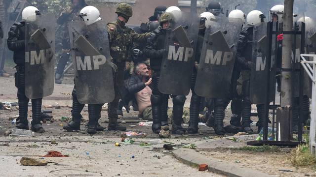 NATO Kosovo Force (KFOR) soldiers clash with local Kosovo Serb protesters in the town of Zvecan