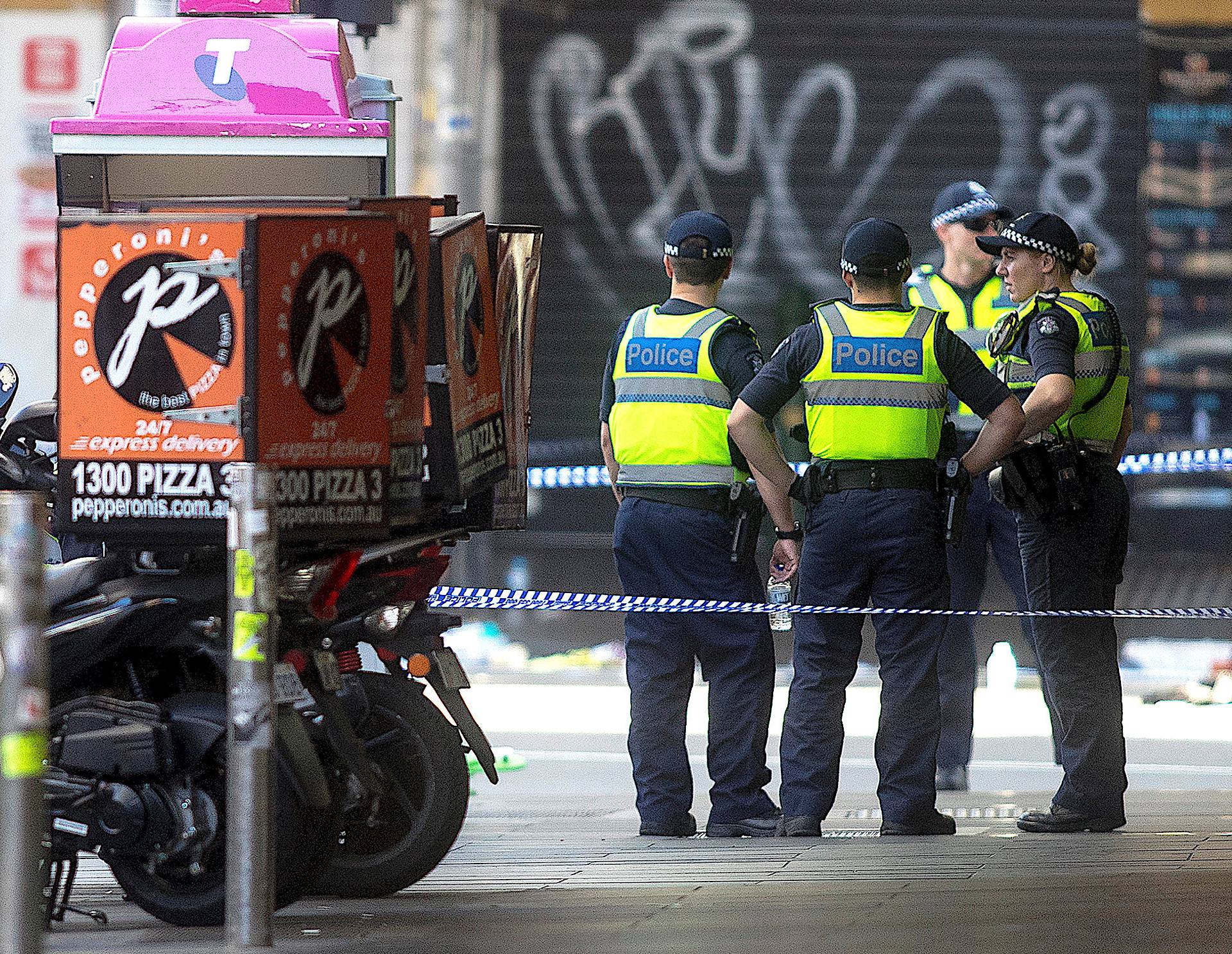 Australian police are seen where a driver was arrested after ploughing into pedestrians at a crowded intersection near the Flinders Street train station in central Melbourne