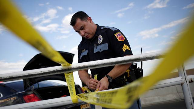 A police cordon is seen after a mass shooting at a Walmart in El Paso