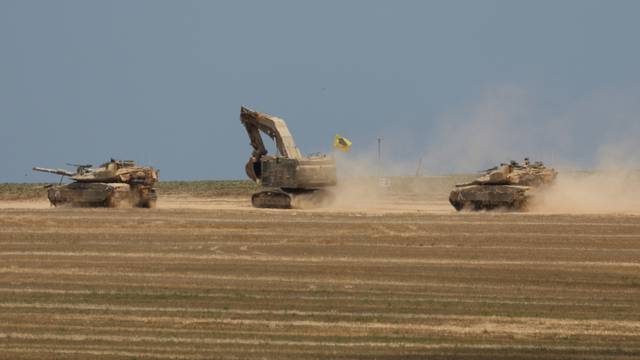 Israeli tanks manoeuvre near the Israel-Gaza Border