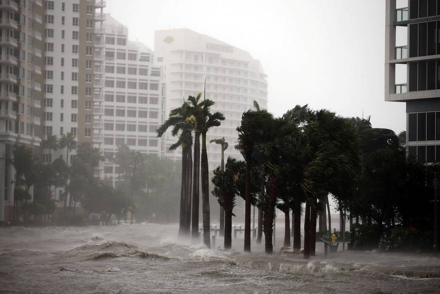 Water rises up to a sidewalk by the Miami river as Hurricane Irma arrives at south Florida, in downtown Miami, Florida, U.S.
