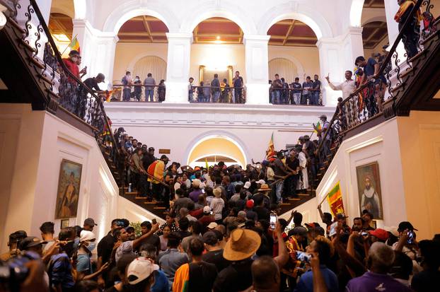 Demonstrators protest inside the President's House, after President Gotabaya Rajapaksa fled, in Colombo