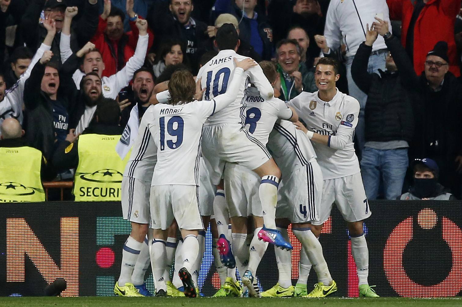 Real Madrid's Casemiro celebrates scoring their third goal with team mates
