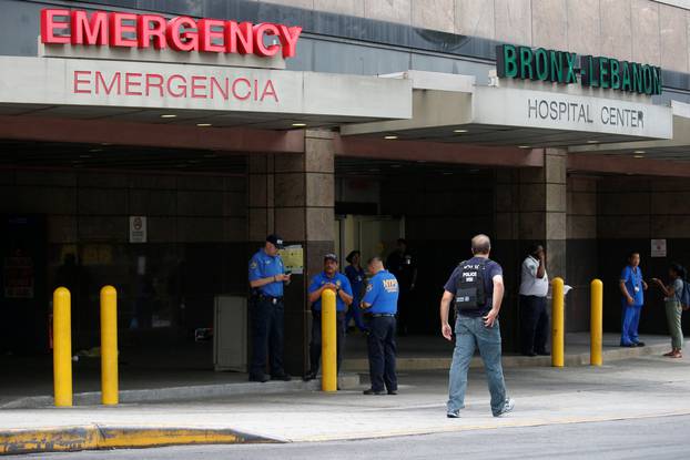 NYPD officers work outside Bronx-Lebanon Hospital, after an incident in which a gunman fired shots inside the hospital, in New York