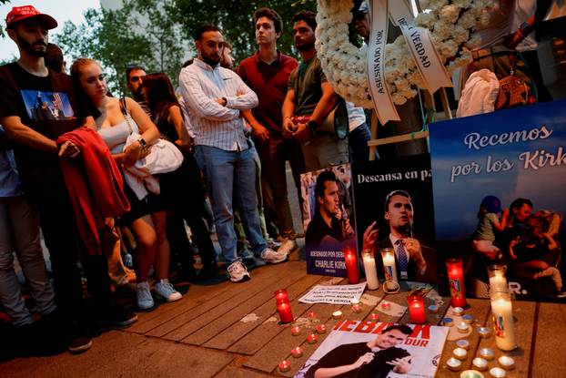 People mourn Charlie Kirk outside the U.S. embassy in Madrid