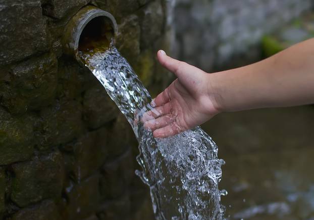 Outstretched,Hand,Under,The,Water,Leaking,Underground,Source