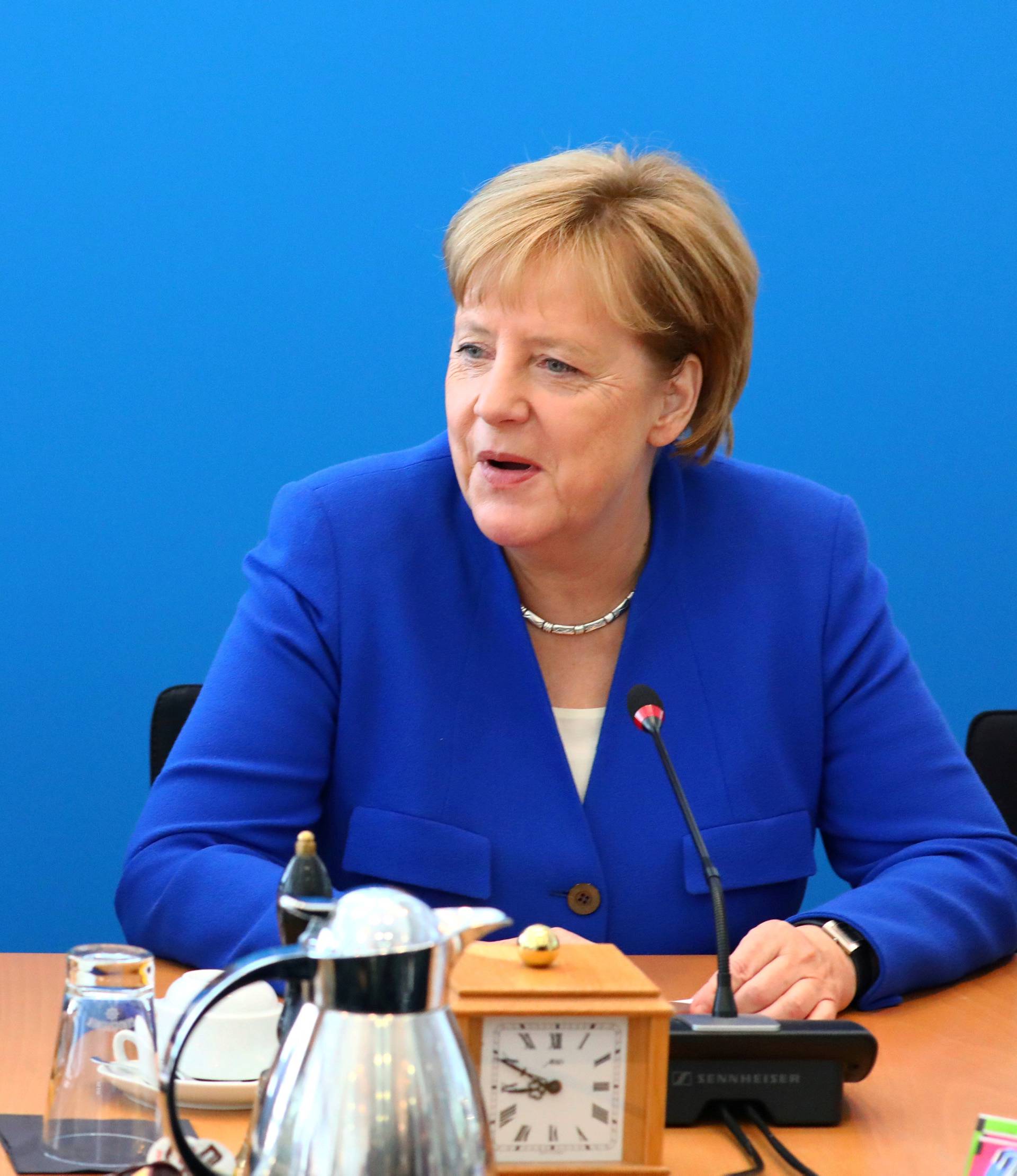 FILE PHOTO: German Chancellor Angela Merkel  (right) and Christian Democratic party Secretary General Annegret Kramp-Karrenbauer at a CDU leadership meeting in Berlin,