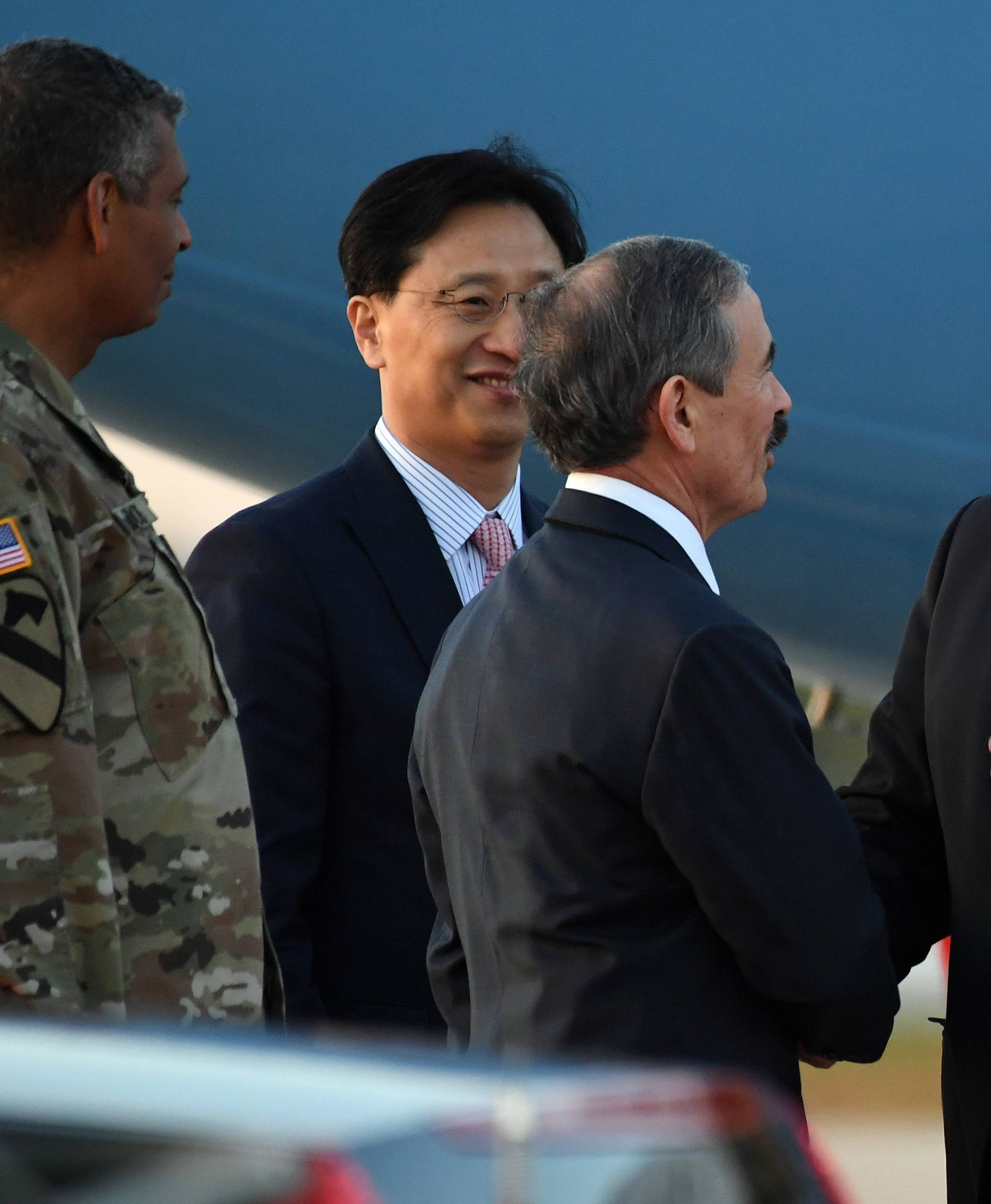 U.S. Secretary of State Mike Pompeo is greeted by U.S. Ambassador to South Korea Harry Harris upon his arrival at Osan Air Base in Pyeongtaek