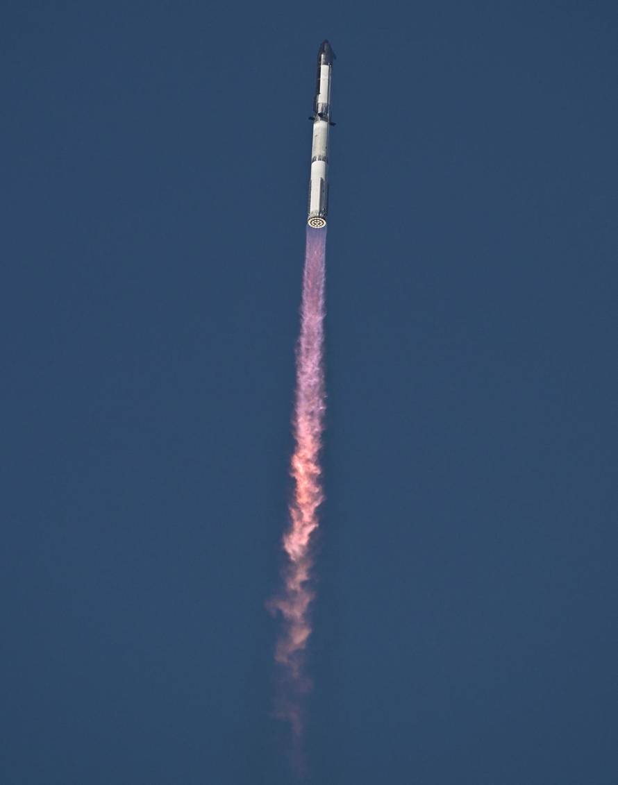 A SpaceX Super Heavy booster carrying the Starship spacecraft lifts off on its 10th test flight