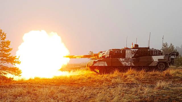 FILE PHOTO: Danish army Leopard 2A7 tanks and Estonian army CV-90 infantry fighting vehicles attend live shooting exercise in Perakula