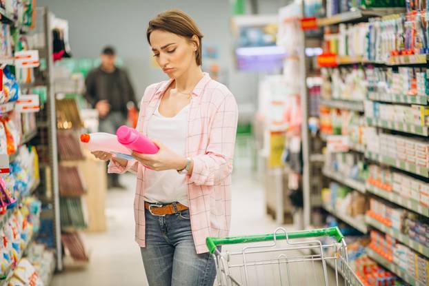 Woman,Buying,At,Grocery,Store