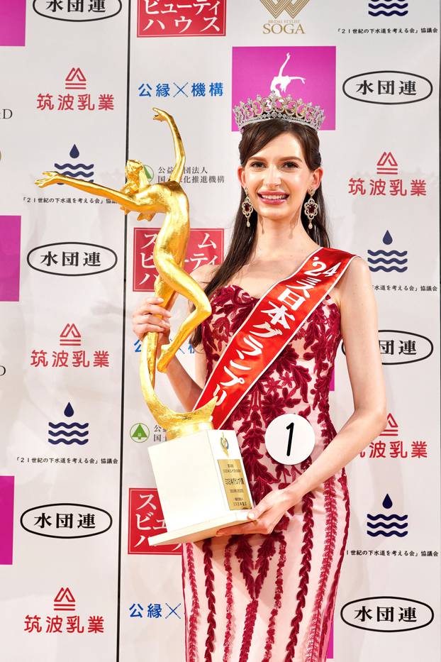 Karolina Shiino, the winner of the Miss Japan 2024, poses with her trophy at the contest in Tokyo