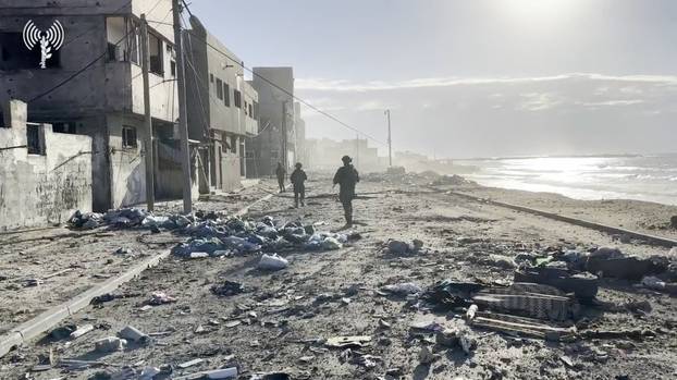 FILE PHOTO: Israeli soldiers operate, amid the ongoing ground operation of the Israeli army against Palestinian Islamist group Hamas, in a location given as Gaza Strip