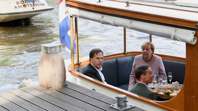 Former German Chancellor Merkel and Dutch PM Rutte visit the Anne Frank House in Amsterdam
