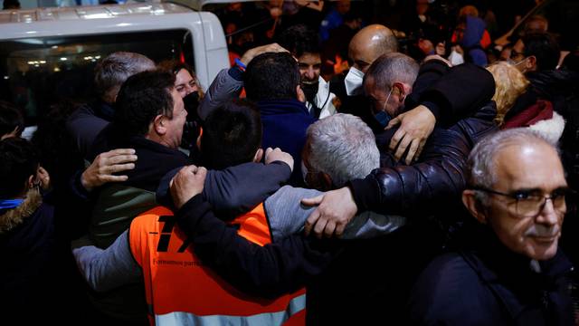 Taxi drivers celebrate arriving from Poland with families fleeing Russia's invasion of Ukraine in Madrid